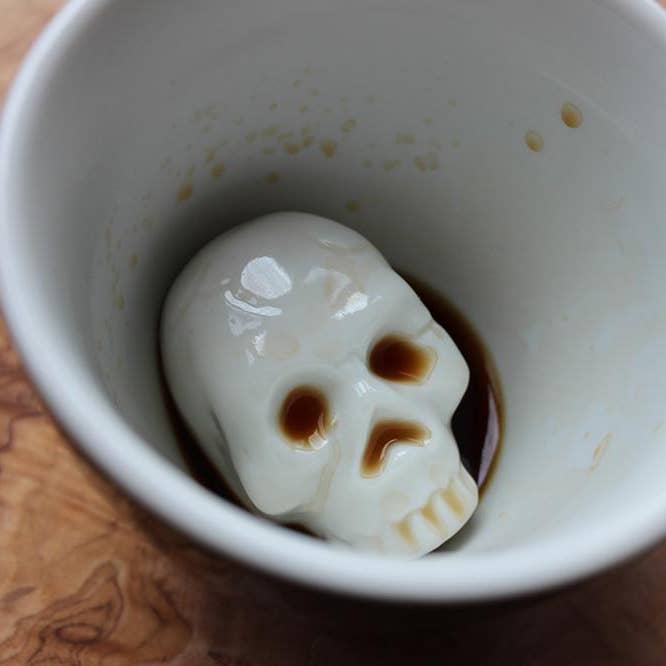 Ceramic SKULL Creepy Surprise Mug (11 oz. - Black) for wholesale by Creature Cups