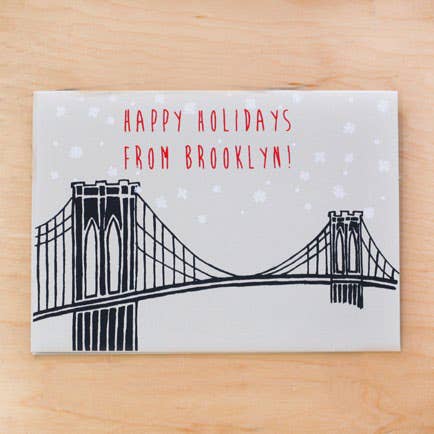 GLÜCKWUNSCHKARTE „FROHE FEIERTAGE AUS BROOKLYN“ für den Großhandel von Alphabet Studios