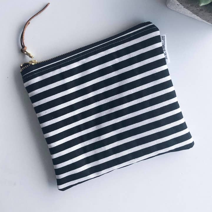 Simple zipped pouch in black and white stripes for wholesale by September Skye Bags & Accessories