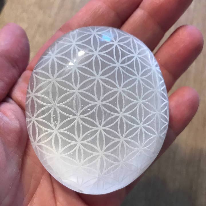 Engraved Selenite Palmstone for wholesale by Zen and Meow