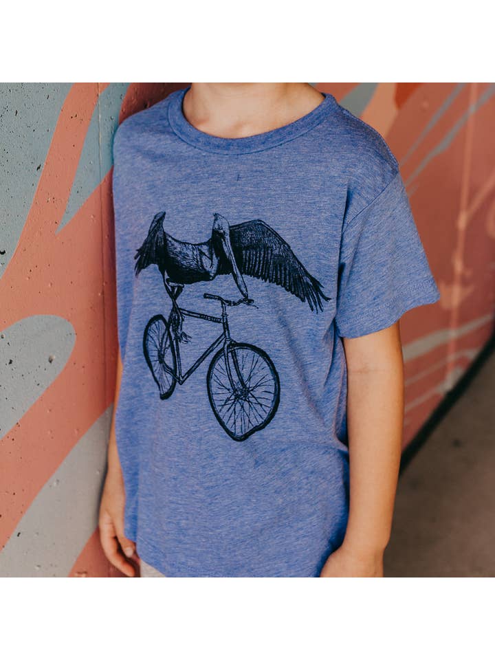 Athletic Blue Pelican On A Bicycle Children's Tee for wholesale on Faire1